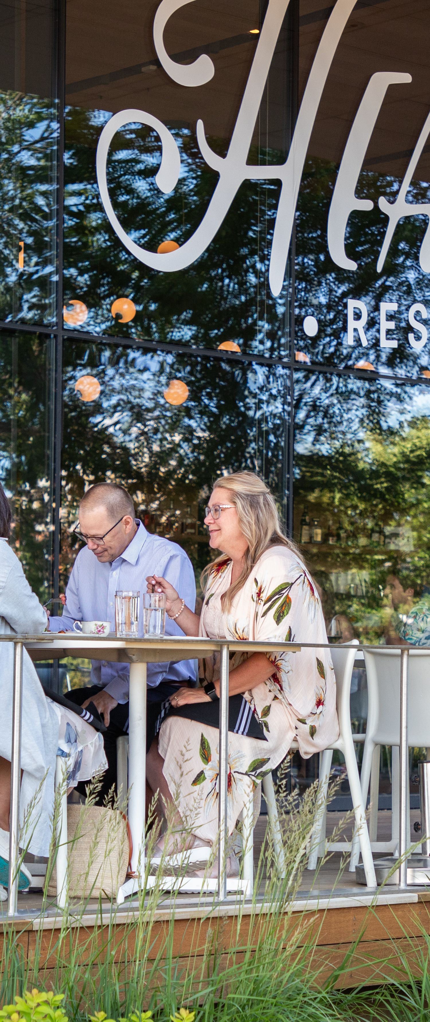 People sitting and eating on the Hearth patio