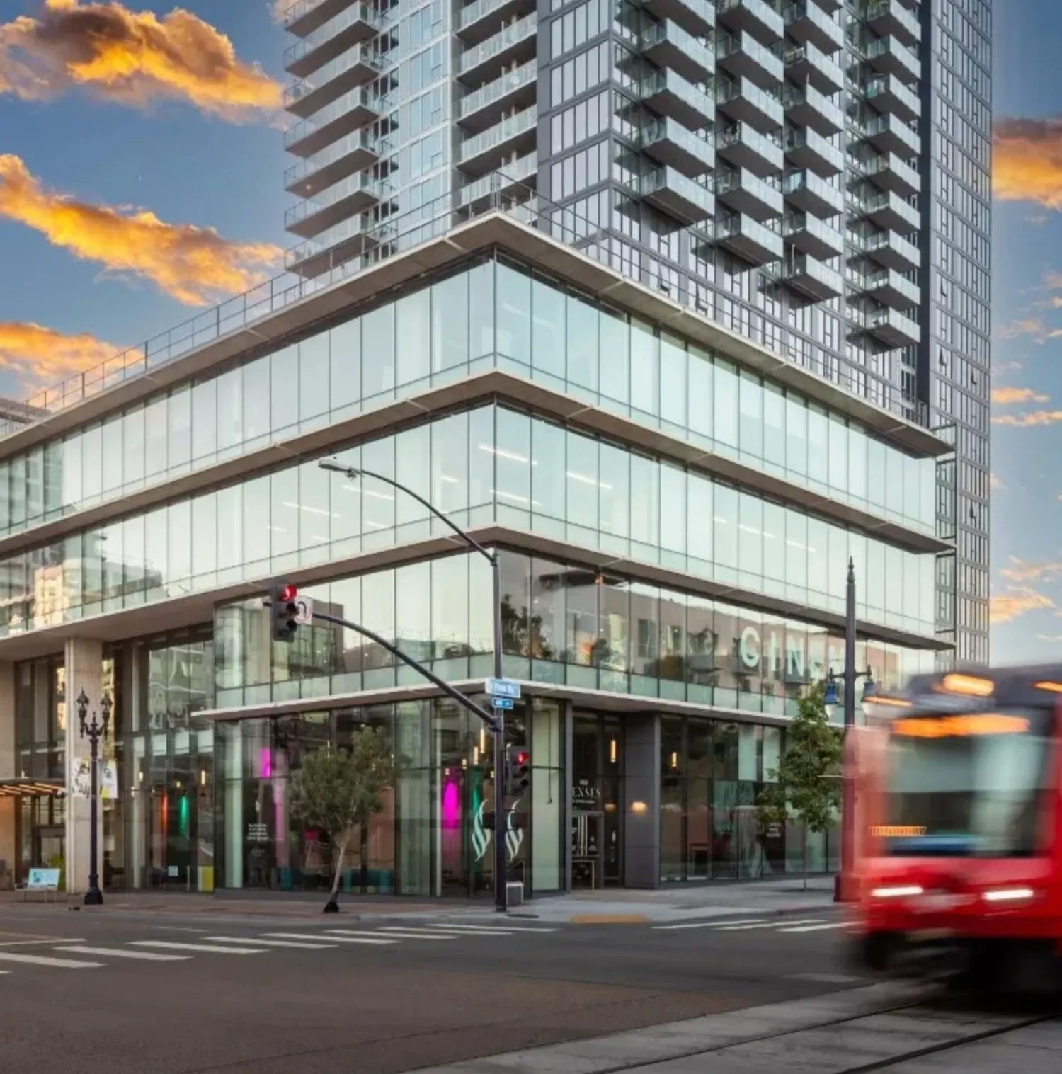 UCSD Park and Market building with trolley going by