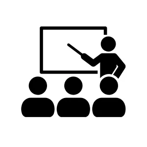 Instructor teaching a group, representing education, training, and capacity building.