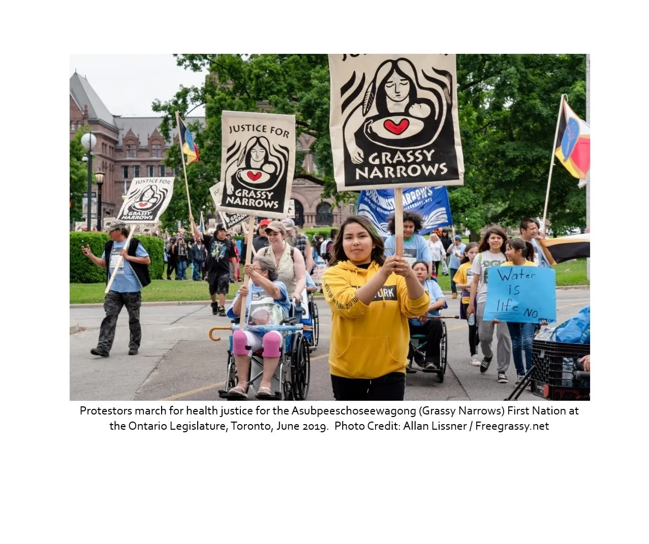 Protestors march for health justice for the Asubpeeschoseewagong (Grassy Narrows) First Nation at the Ontario Legislature, Toronto, June 2019. Photo Credit: Allan Lissner / Freegrassy.net