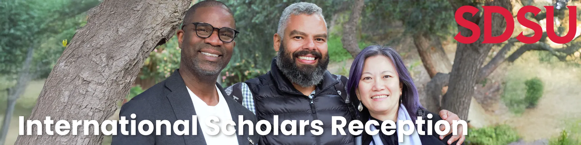 SDSU faculty and international scholars pose for a photograph at the 2025 International Scholars Spring Reception at Scripps Cottage.